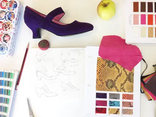 Purple shoe design with sketches and material swatches